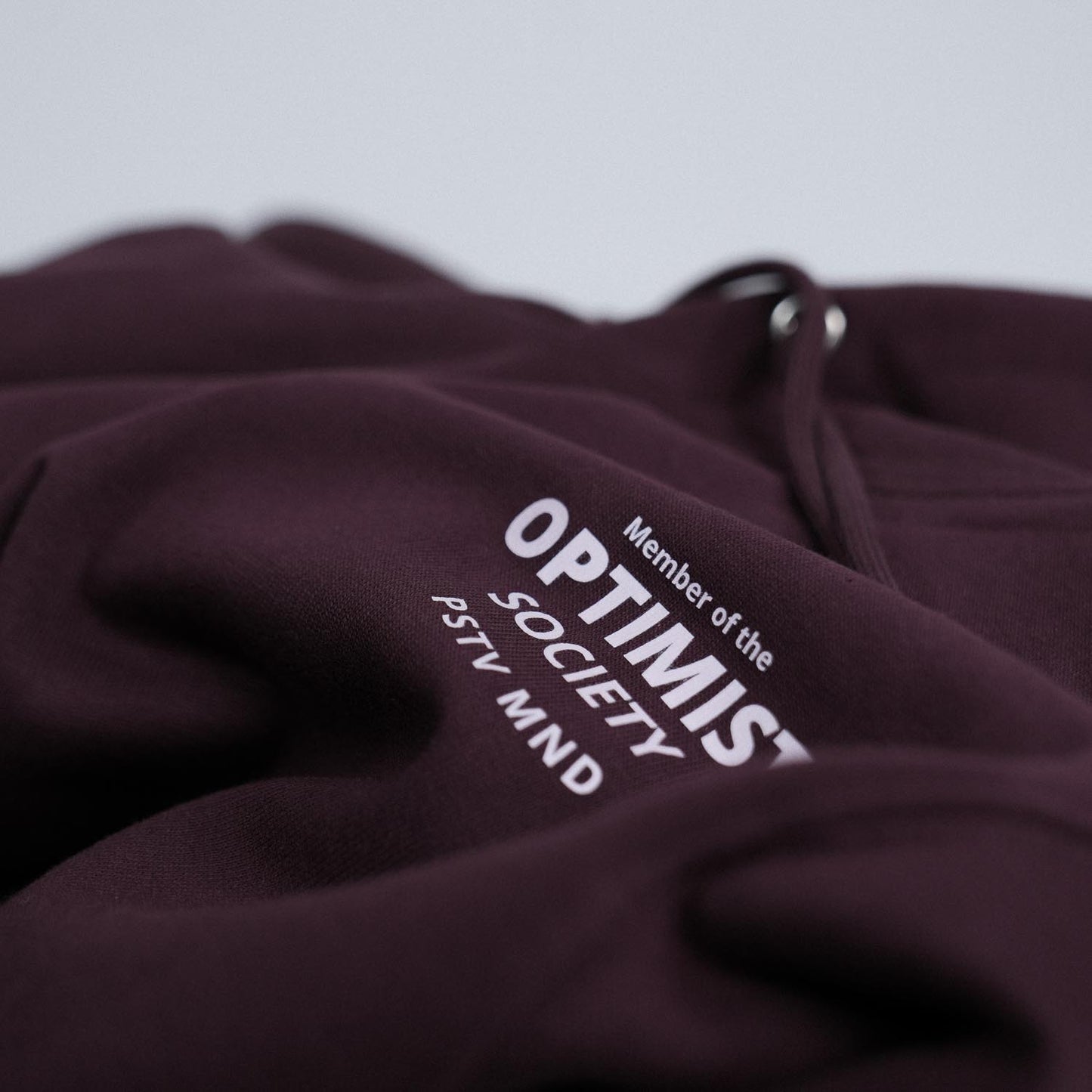 Member of the Optimist Society. Classic Hoodie in Mahagony Brown