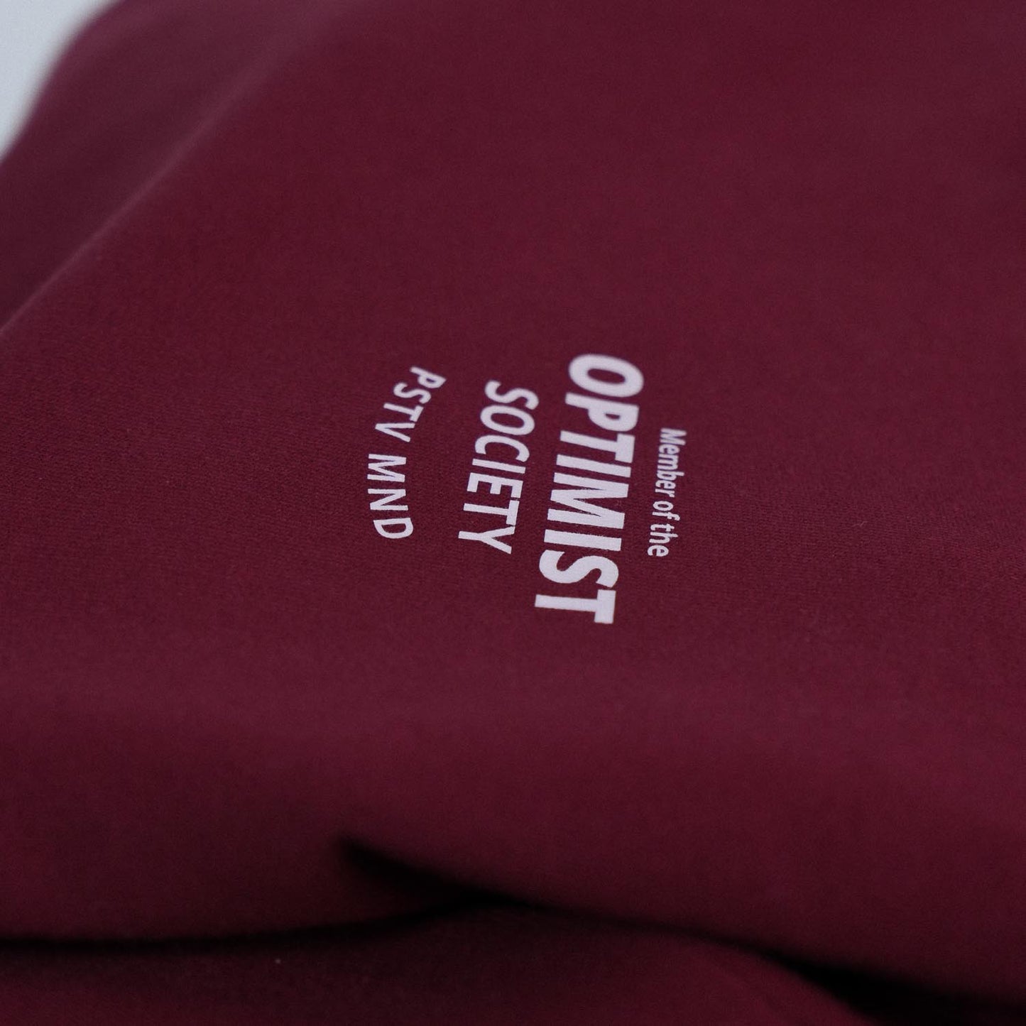 Member of the Optimist Society. Crewneck in Rich Wine Red