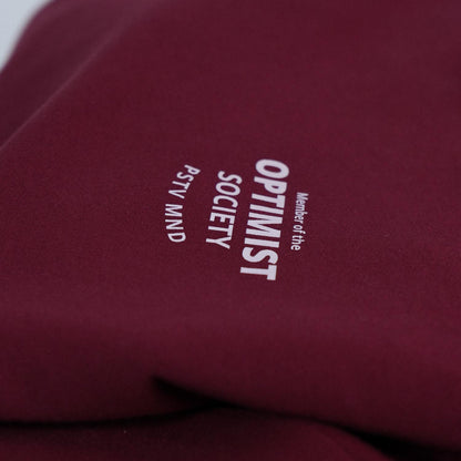 Member of the Optimist Society. Crewneck in Rich Wine Red